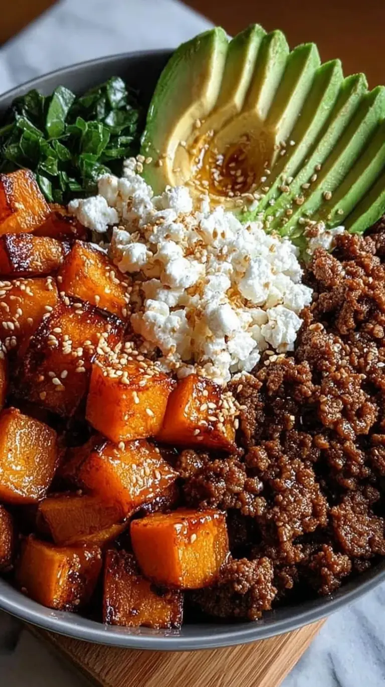 A vibrant bowl with jasmine rice, steamed broccoli, and glazed ground beef topped with sesame seeds and green onions.