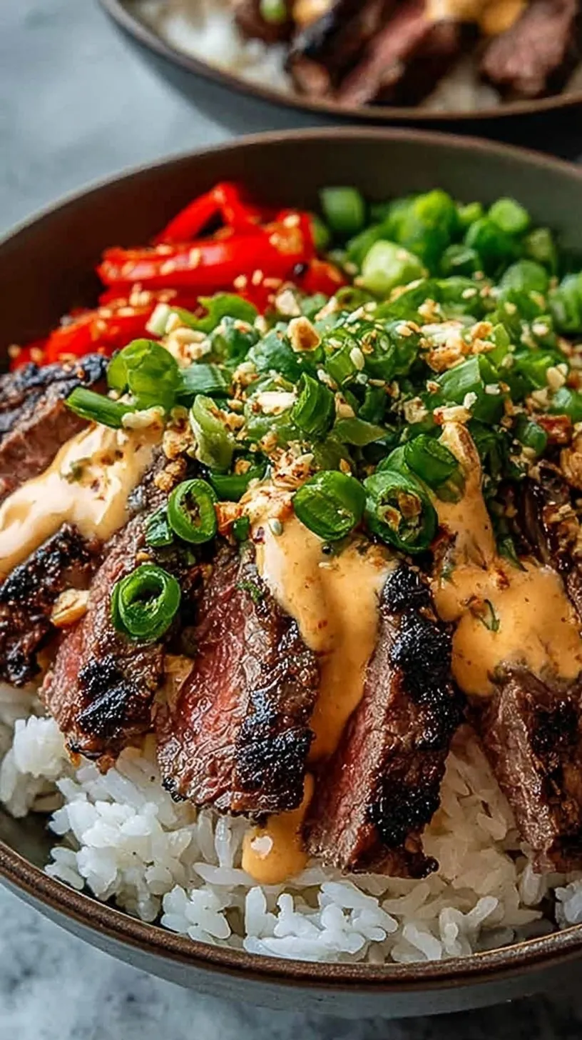 A vibrant rice bowl with seared flank steak, sliced cucumbers, kimchi, and a drizzle of orange spicy sauce.