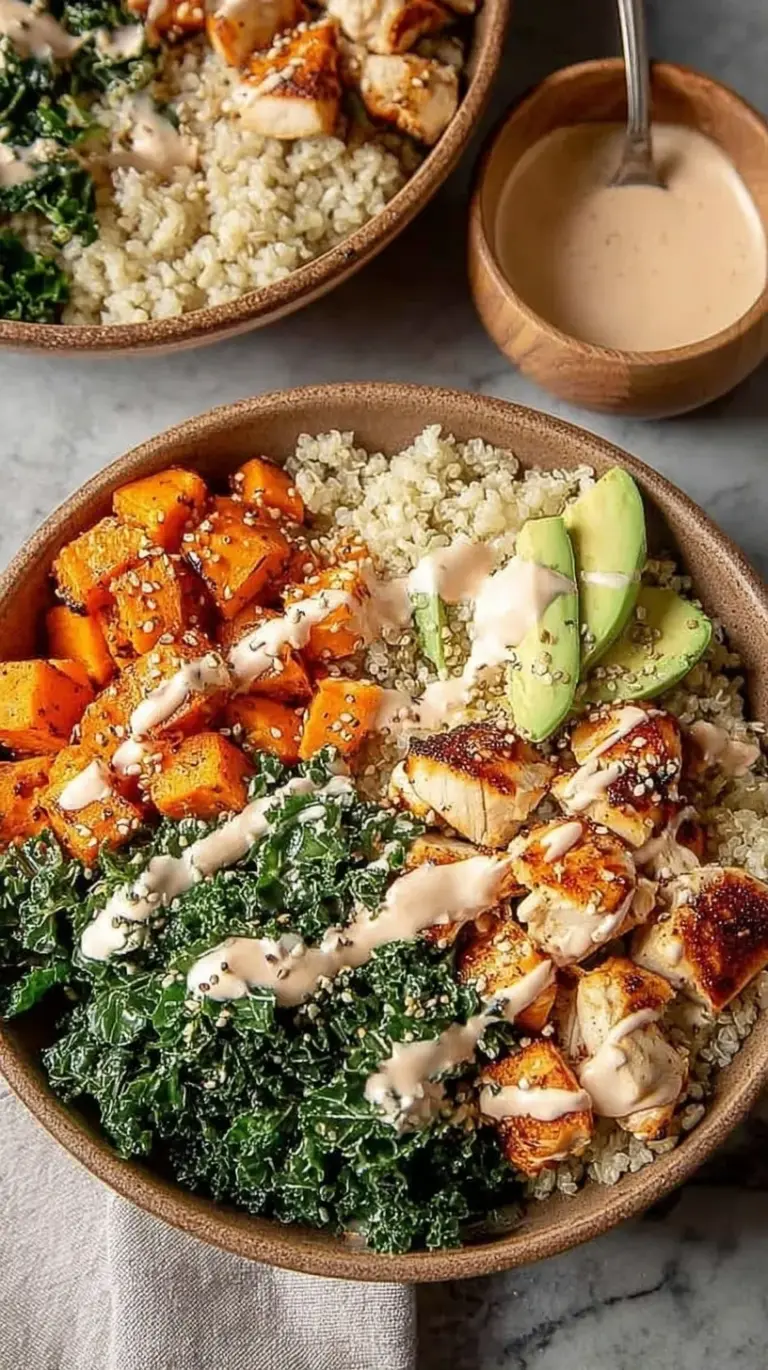Four glass meal prep containers filled with brown rice, roasted chicken cubes, orange sweet potatoes, and dark green kale.