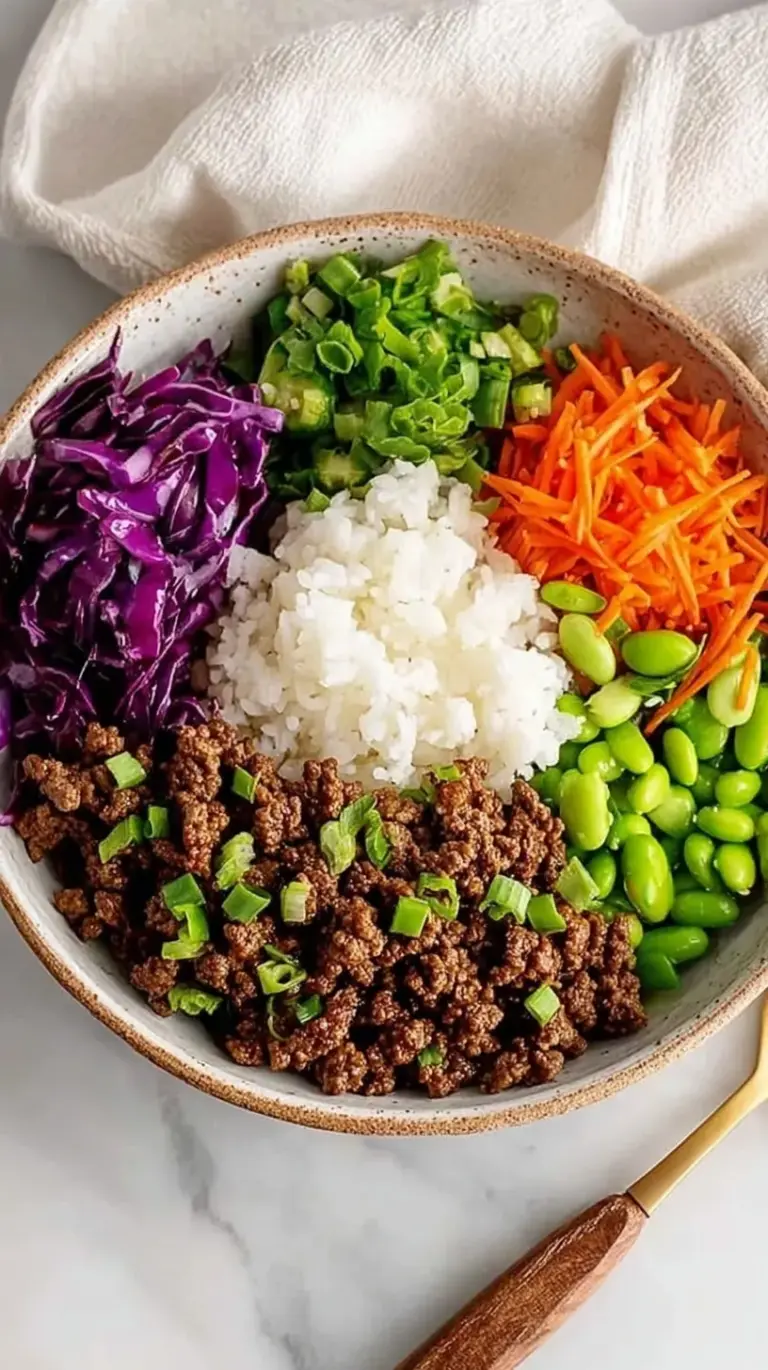 Healthy Teriyaki Beef Bowls with steamed broccoli and jasmine rice in glass meal prep containers.